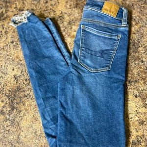 American eagle jeans skinny fit and ripped at the bottom size 0